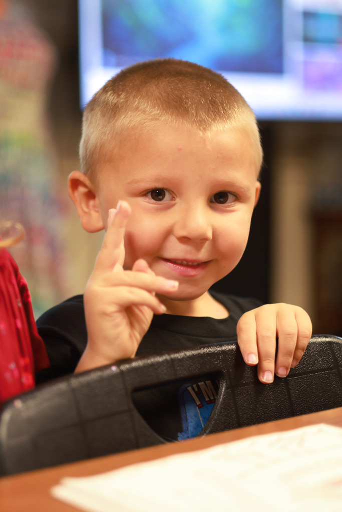 Young student smiles at camera