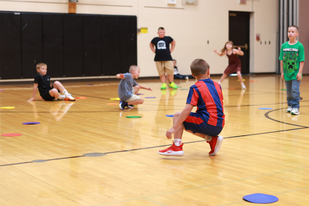 Students playing games in gym
