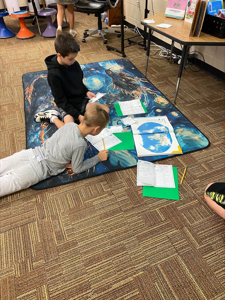 Students reading on the floor