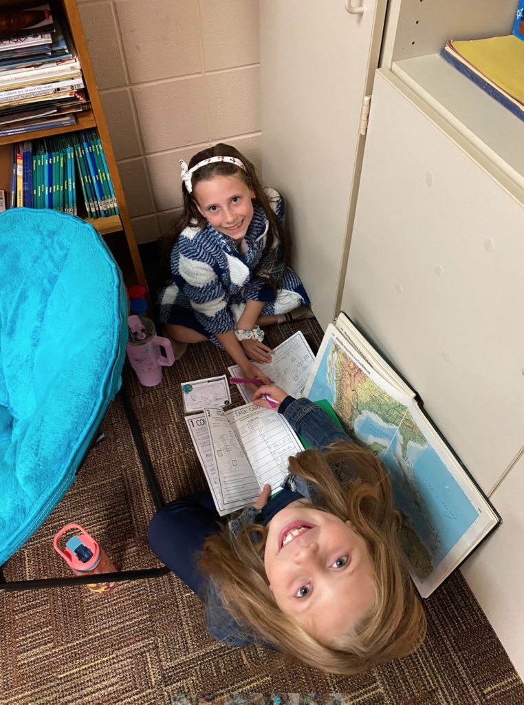 Two students smiling at camera