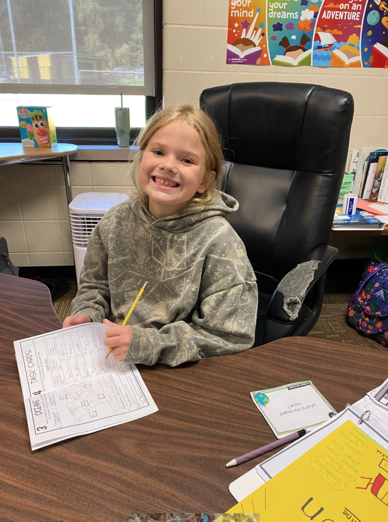 Student smiling at camera
