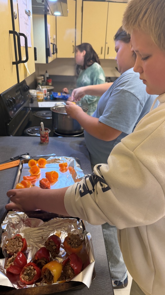 Student stuffing peppers