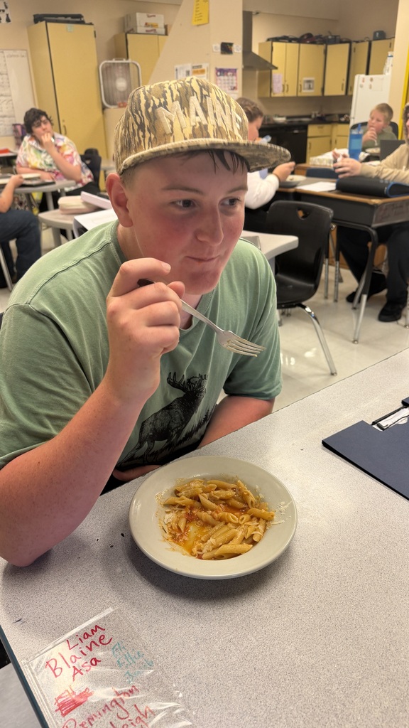 Student eating pasta