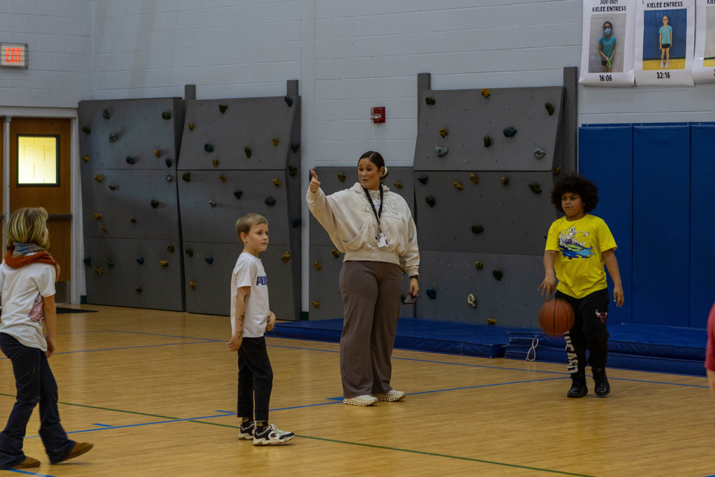 teacher cheers on student