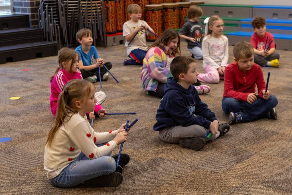 Kids with musical sticks