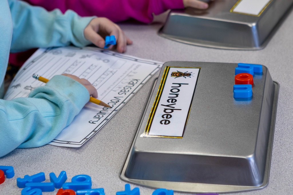 child spelling with magnets