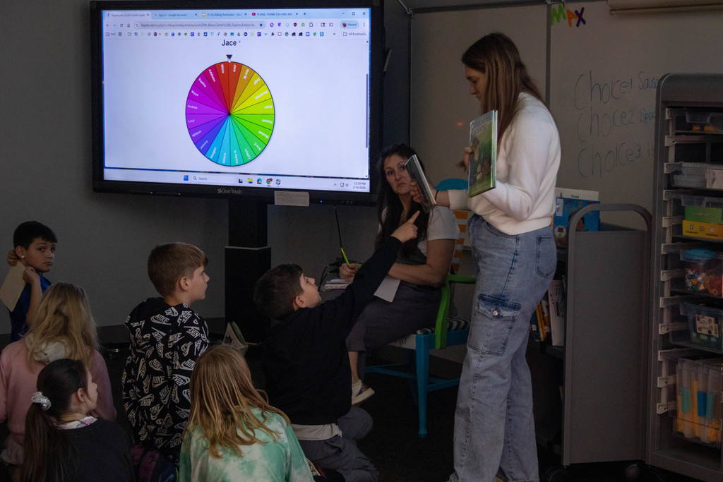 Teacher holding a book.
