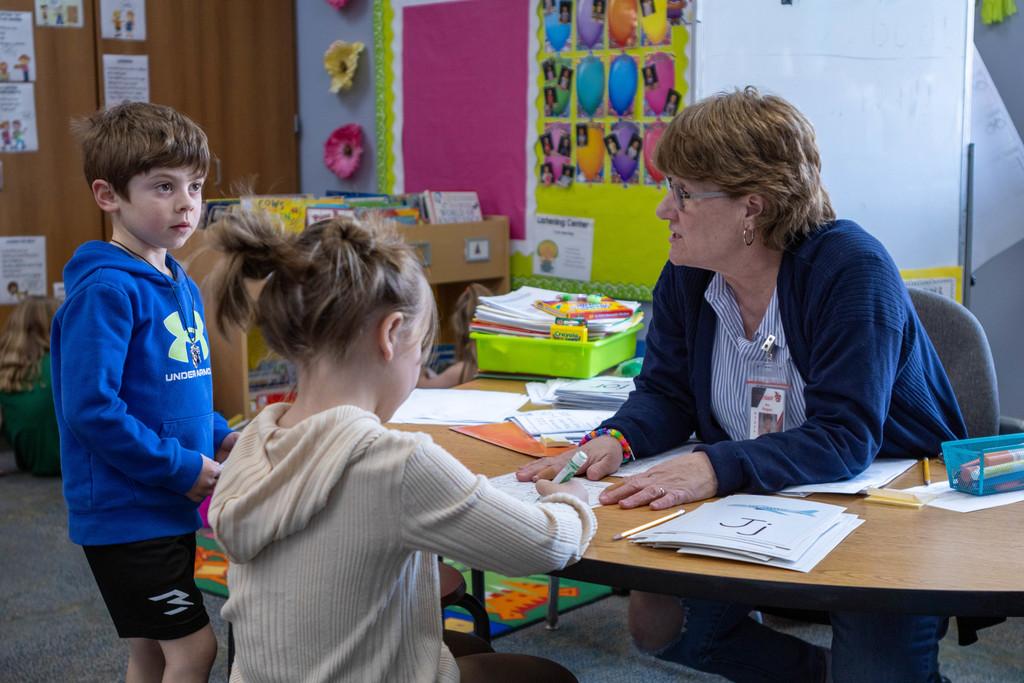 Kids talking to teacher