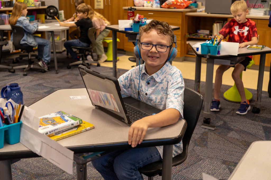 Kid working on reading work.