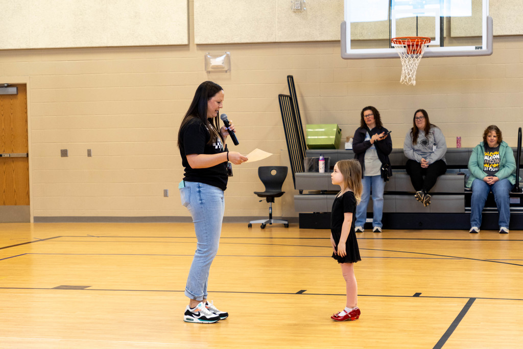 Kid being recognized by teacher.