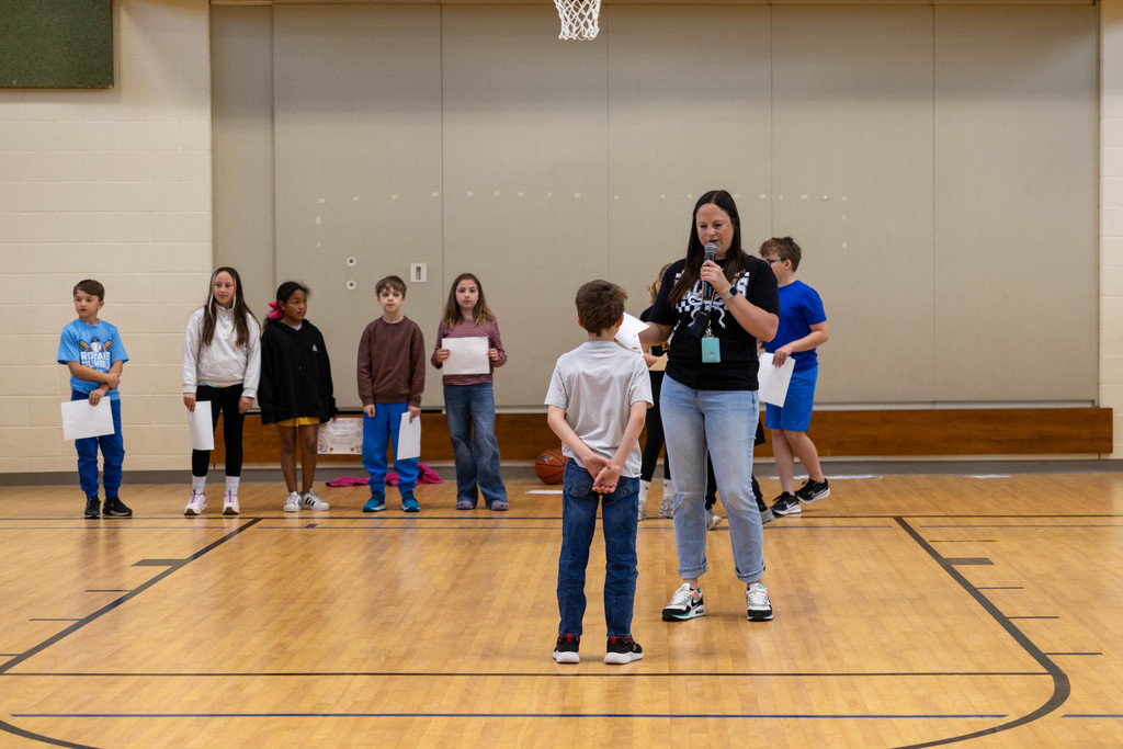 Teacher recognizing student.