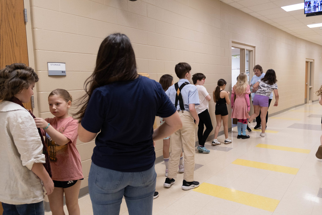 Kids in line for technology.