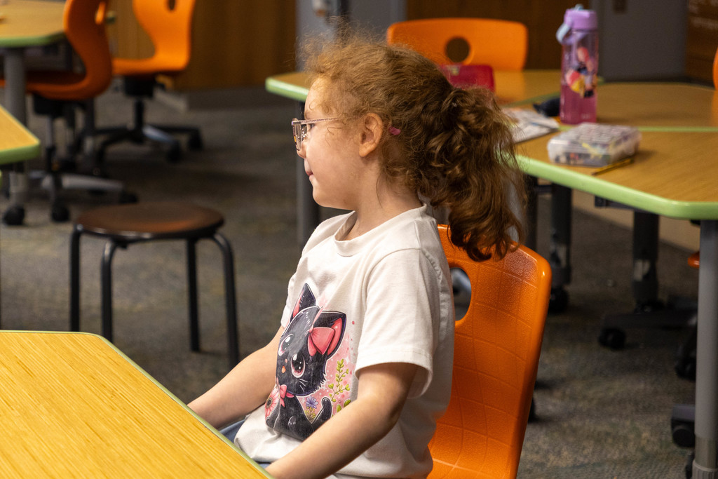 Kid watching class.