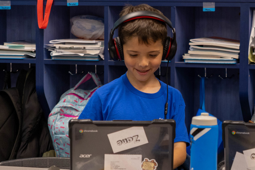 Kid on his computer.