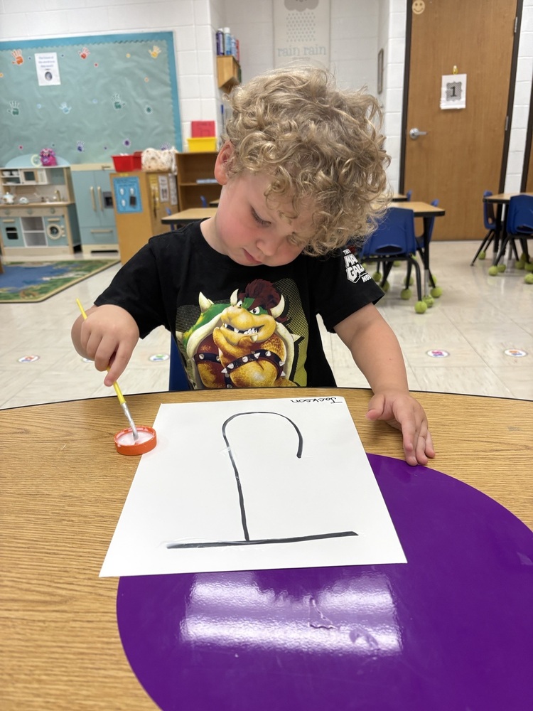 Painting letters in Pre-K