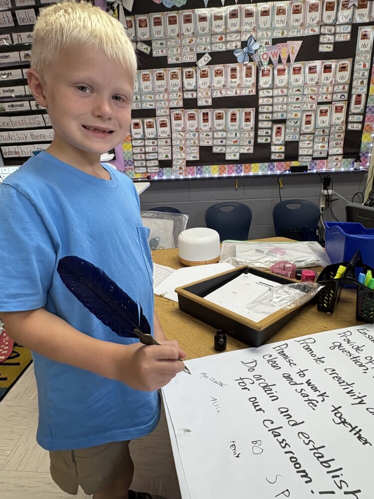 1st Grade signing their classroom constituioln 
