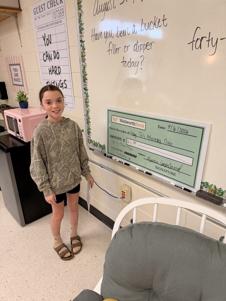 student learning to write a check