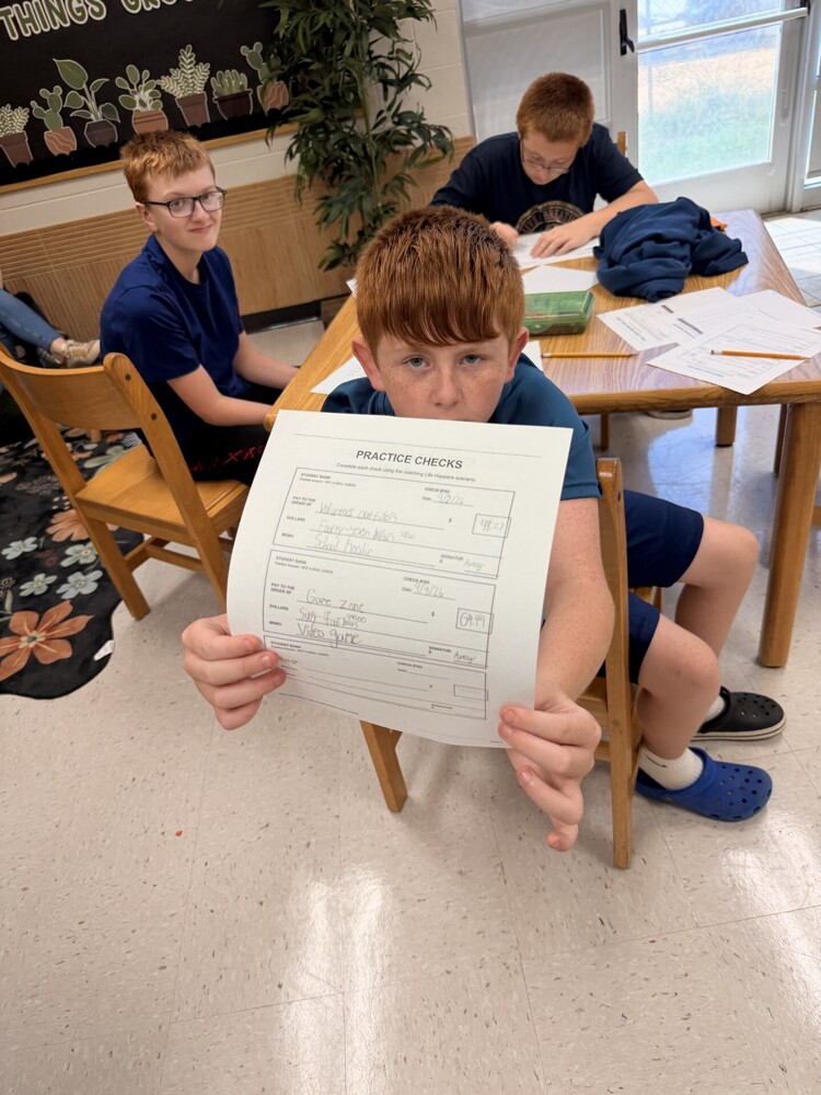 student writing a check
