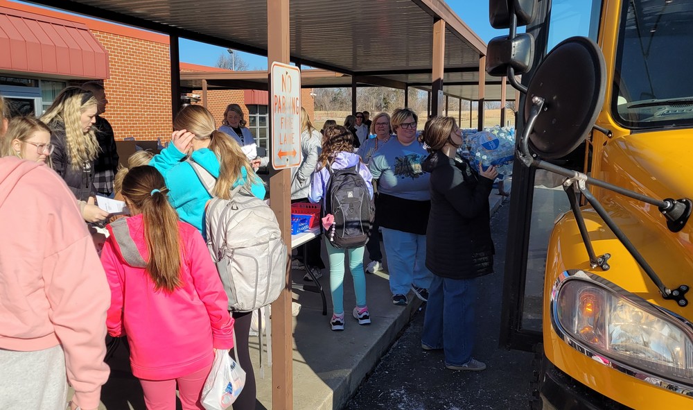 Students getting water and food
