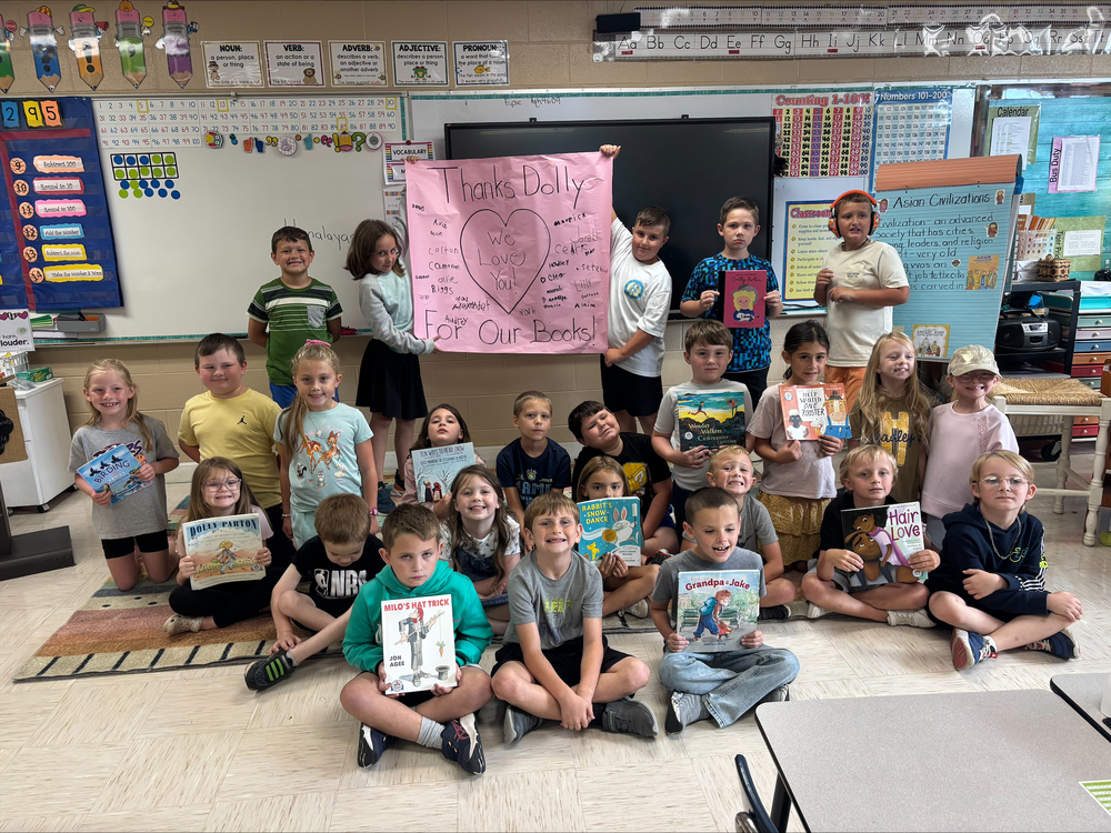 2nd graders reading books from the imagination library