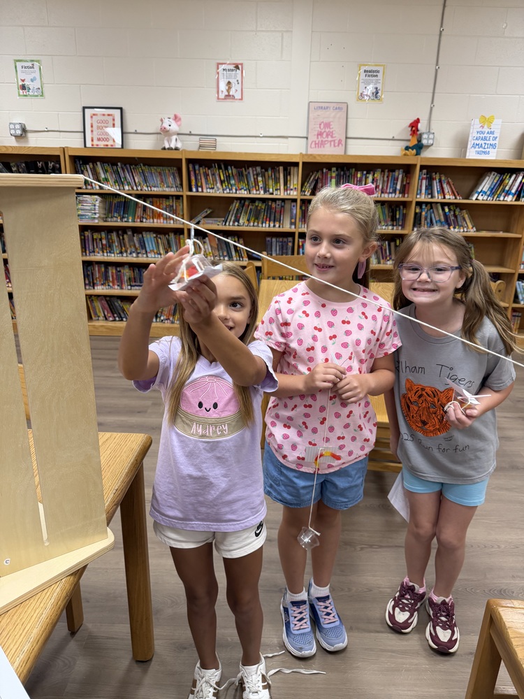 students creating a zip line