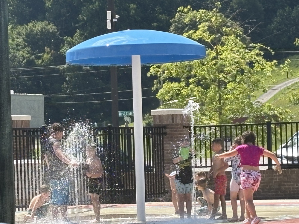 students playing in splash pad