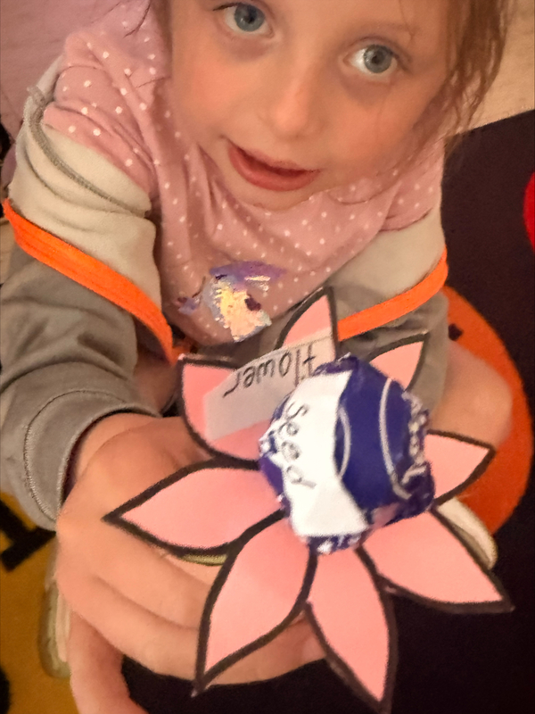 Student holding flower