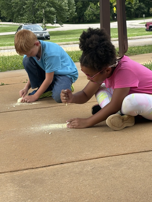 student diggin for fossils