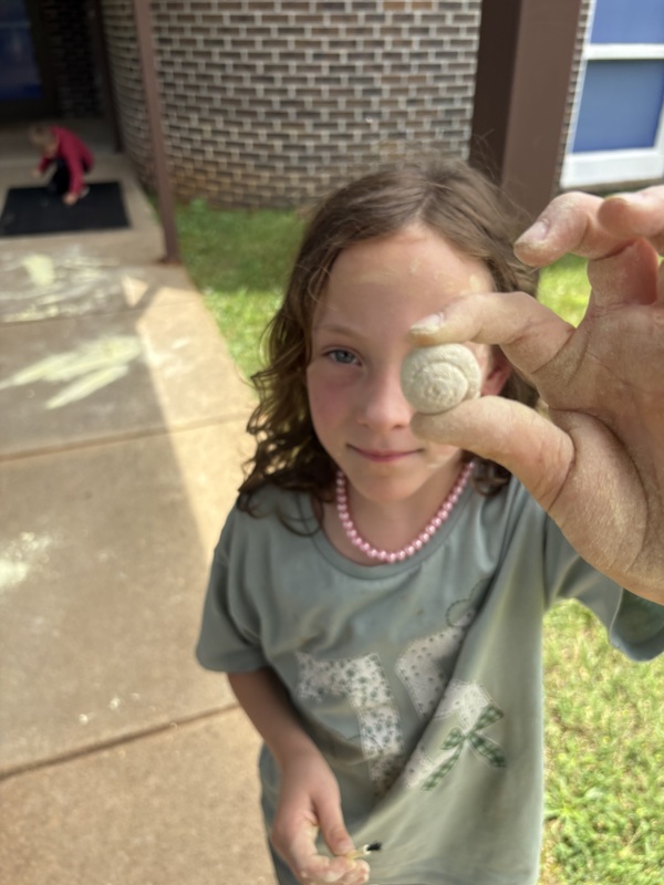 student holding gossile