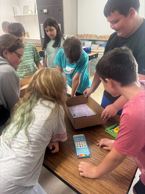 Students building marble mazes