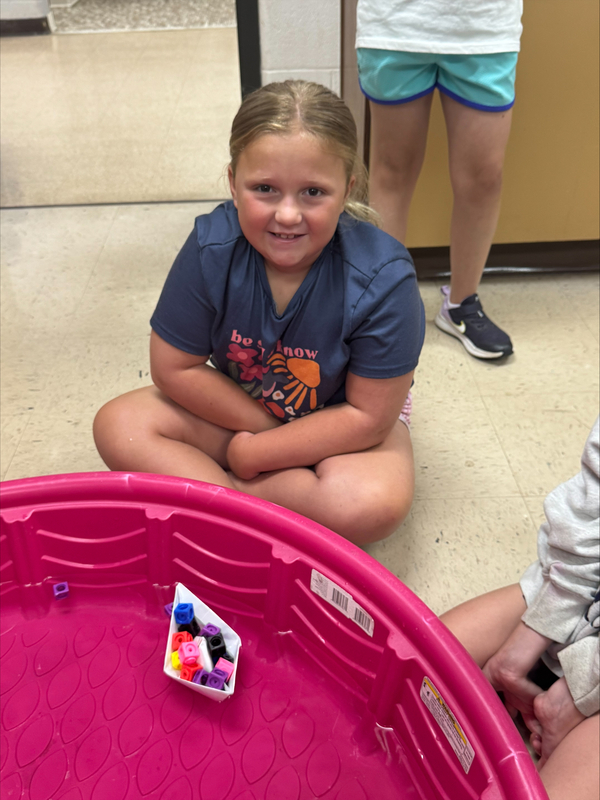 students testing boats