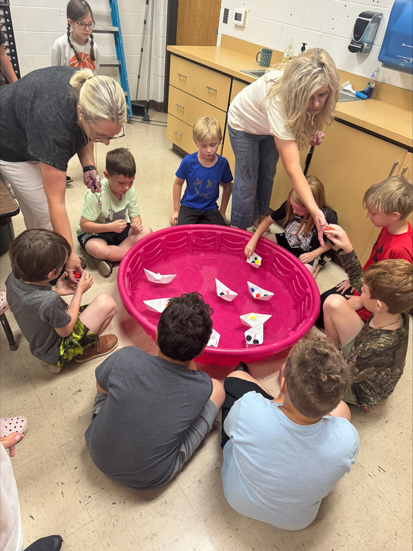 students testing boats