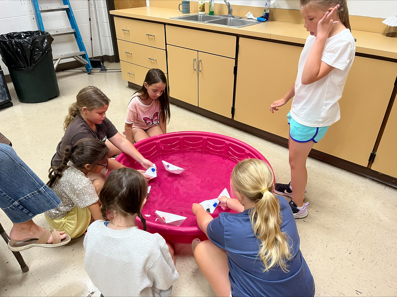 students testing boats