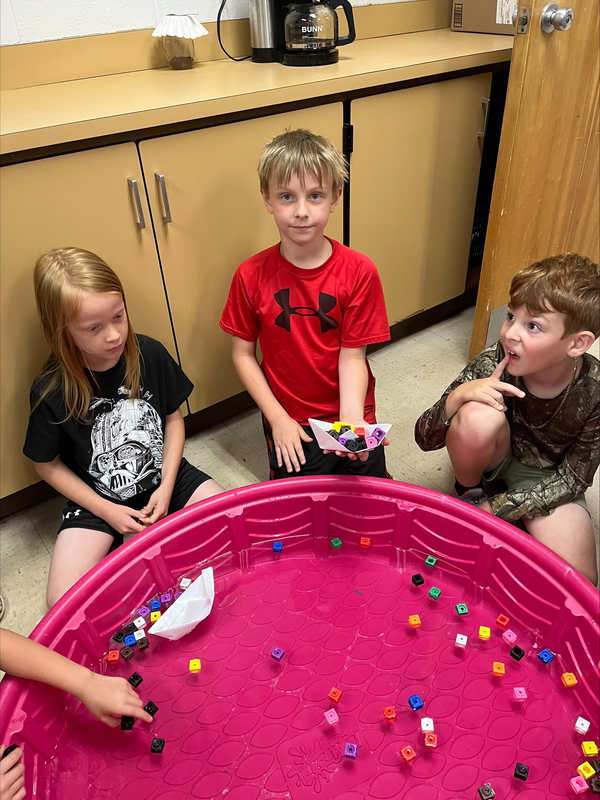 students testing boats