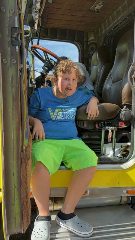 student viewing tow truck