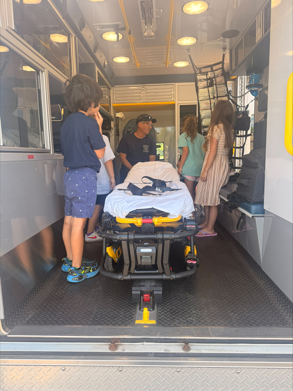 Students visit with EMS