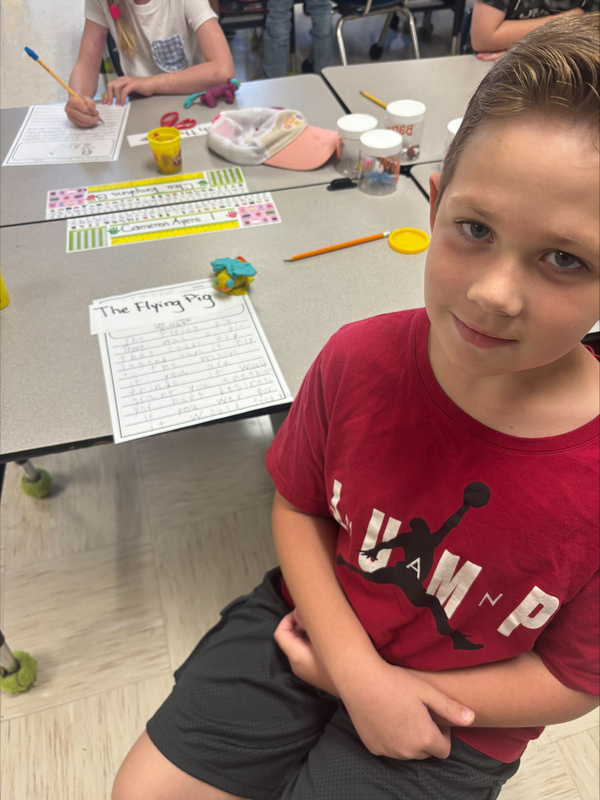2nd grade students creating fairytale characters with Play Doh