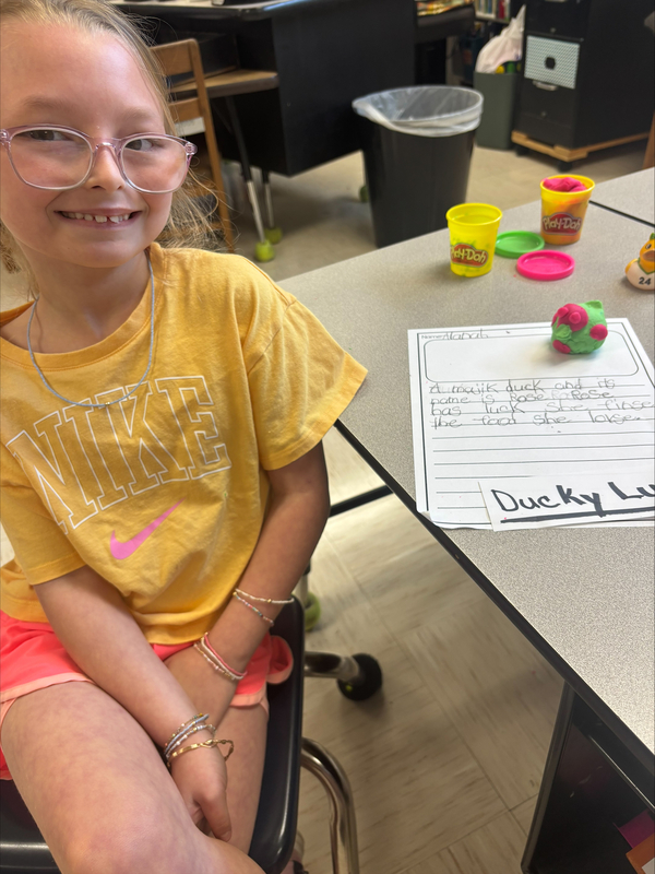 2nd grade students creating fairytale characters with Play Doh