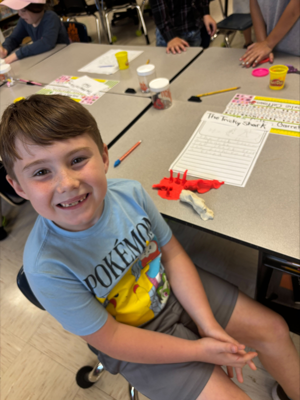 2nd grade students creating fairytale characters with Play Doh