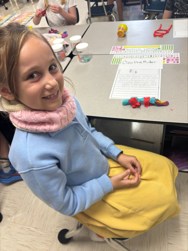2nd grade students creating fairytale characters with Play Doh