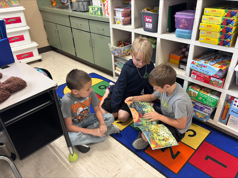 2nd graders reading books from the imagination library