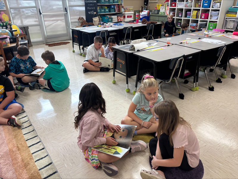 2nd graders reading books from the imagination library