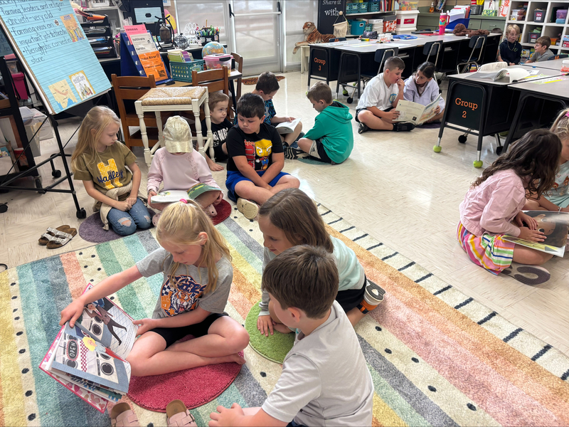 2nd graders reading books from the imagination library