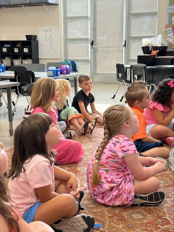Officer Chris Carter reading to Kindergarten