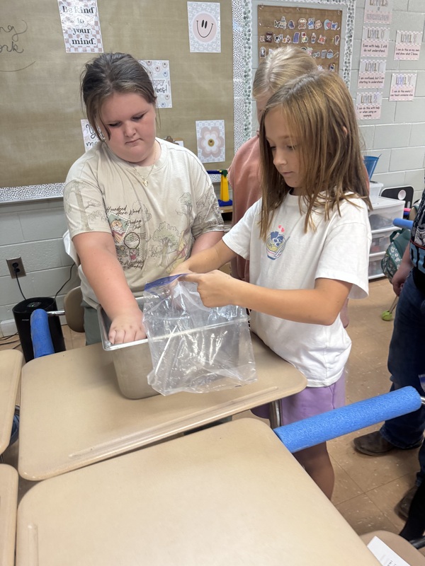 Students experimenting with physical change in science class 