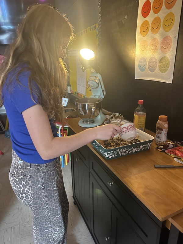 ISM student measuring ingredients for the dip