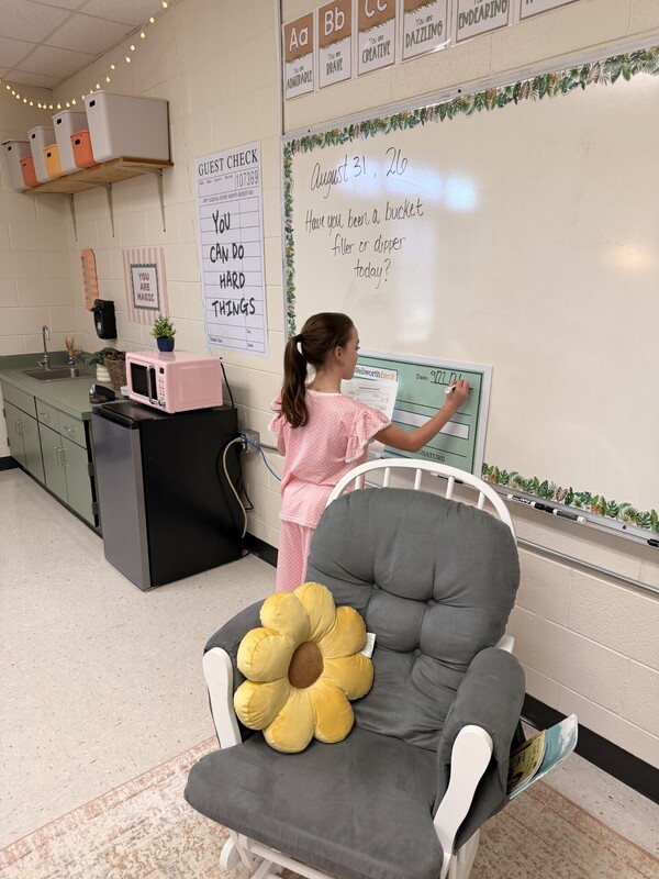 student learning to write a check
