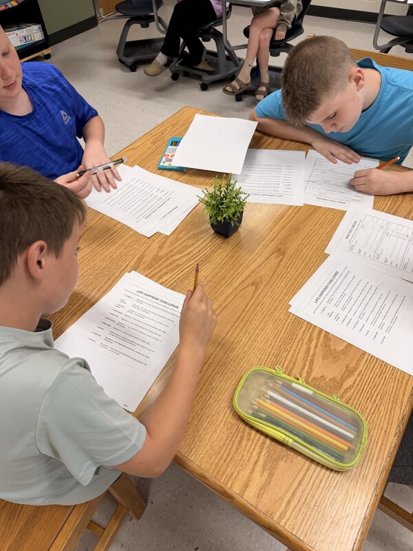student learning to write a check