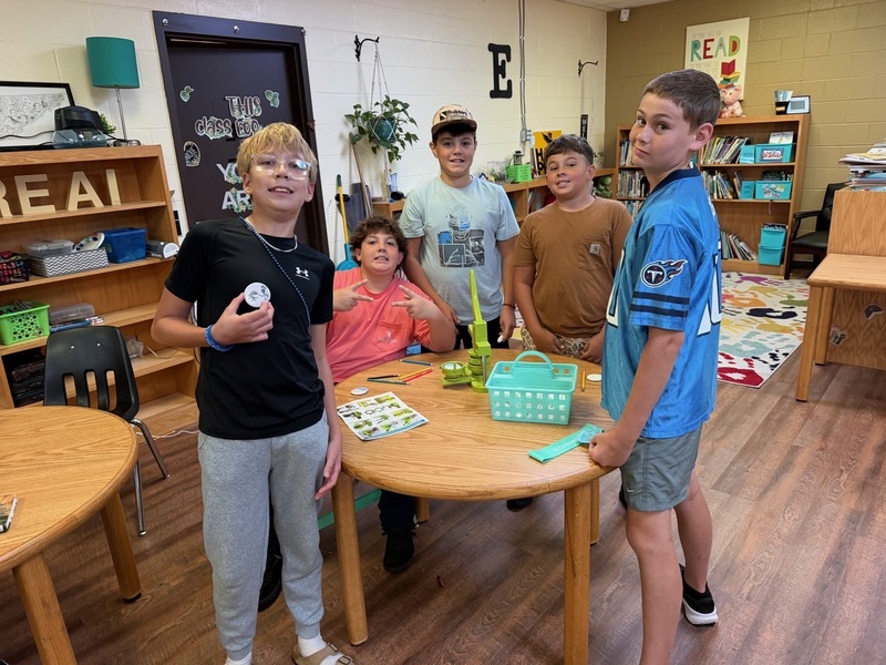 students with their buttons they created