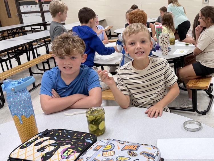 3rd grade students tasting pickles they canned